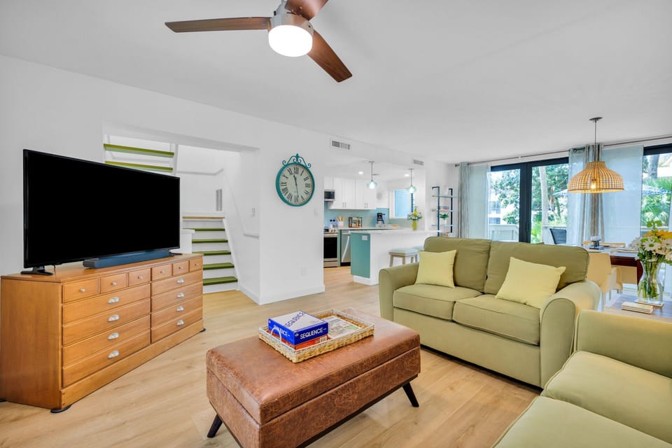 Discover a welcoming open-concept living area, complete with plush furniture to gather with your beloved ones after a day full of island exploration.
