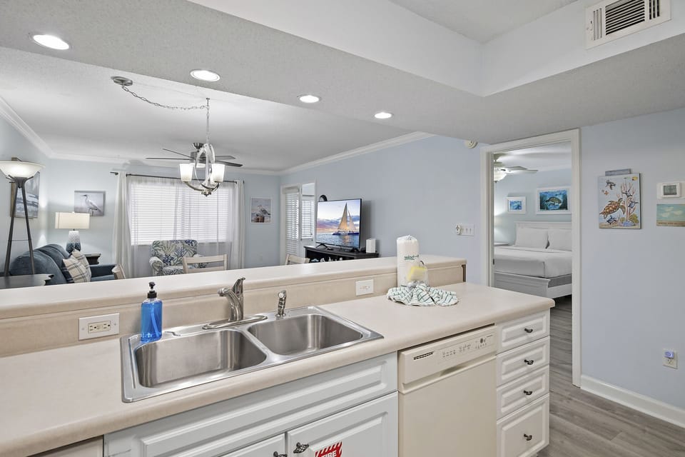 A bright kitchen with a pass-through bar that keeps you connected to the living space.