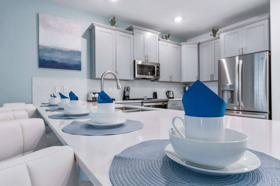 Elegant dining area with stylish table setting, modern decor, and open layout
