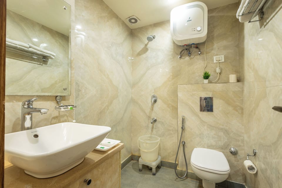 Shower, free toiletries, hair dryer, slippers
