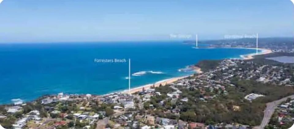 300m to Spoon Bay or 350m to Forresters Beach
