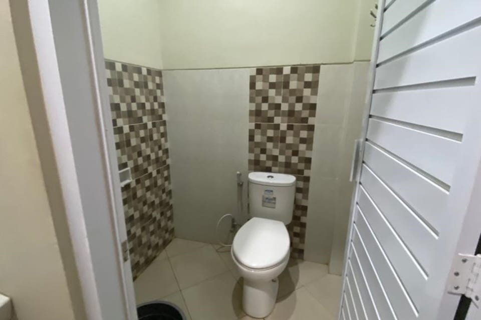 Economy Double Room | Bathroom | Shower, towels, soap