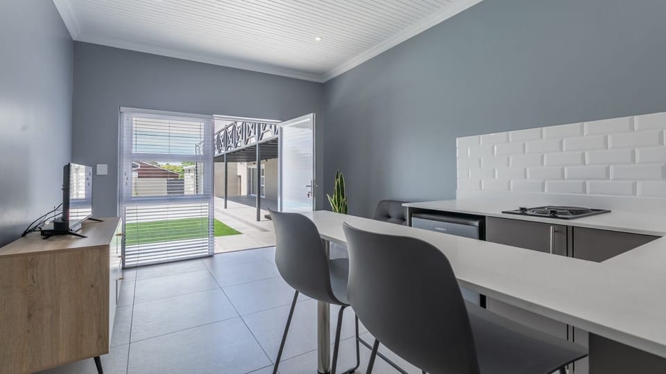 Comfort Twin Room, Pool View | Living area | 30-inch Smart TV with cable channels