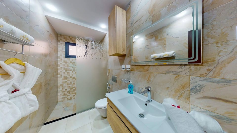 Shower, free toiletries, hair dryer, bathrobes