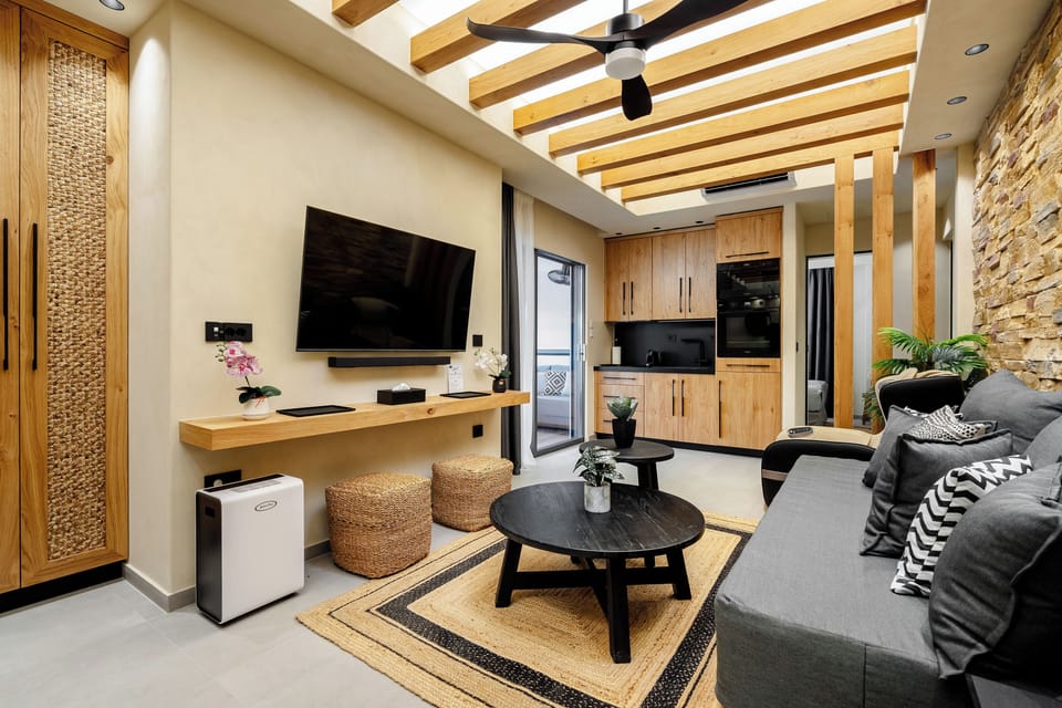 Luxury Apartment, Private Pool | Living area | 55-inch Smart TV with satellite channels, computer monitors