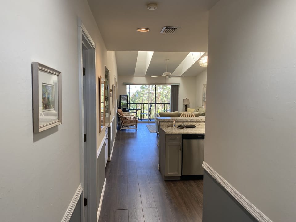 Bright open living area with vaulted ceiling and skylights.