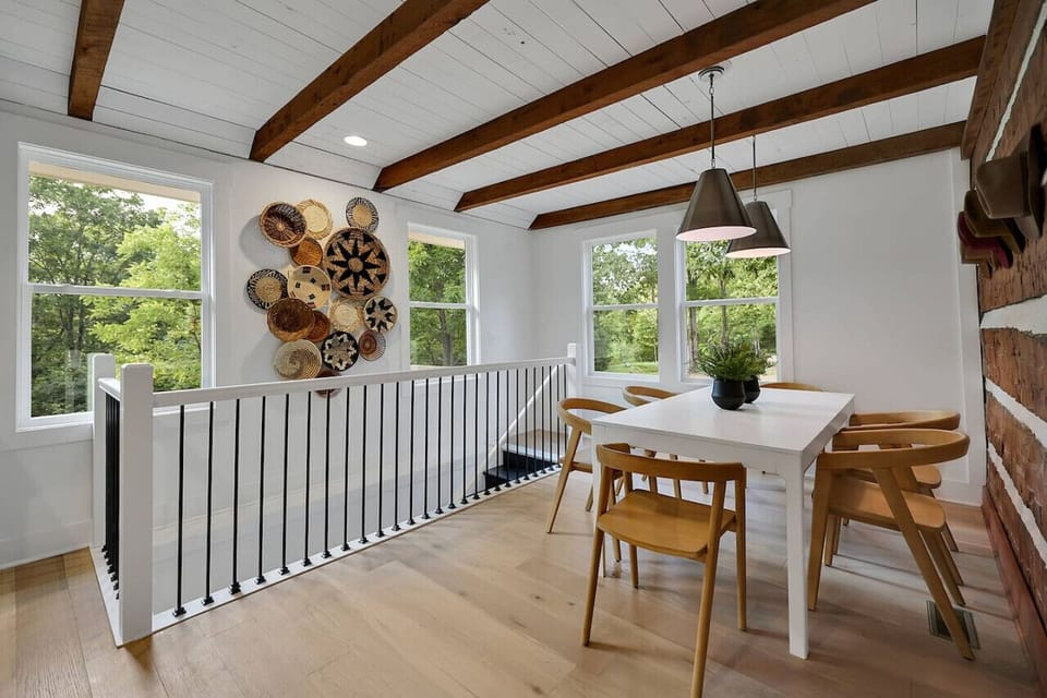 The dining room with the staircase leading down to the walkout basement.