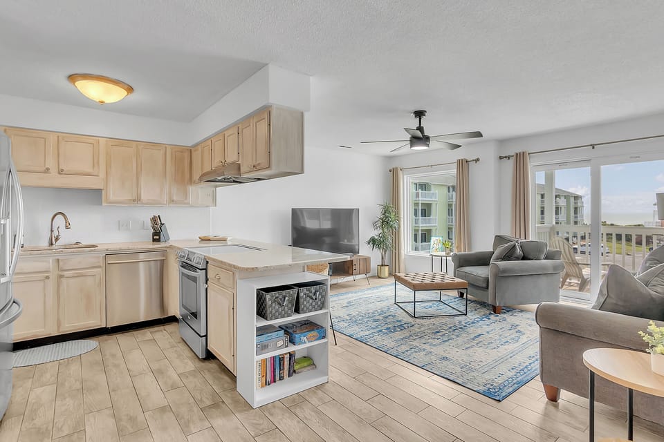 Relax in your bright, open-concept space where the modern kitchen flows seamlessly into your comfortable living area with city views.