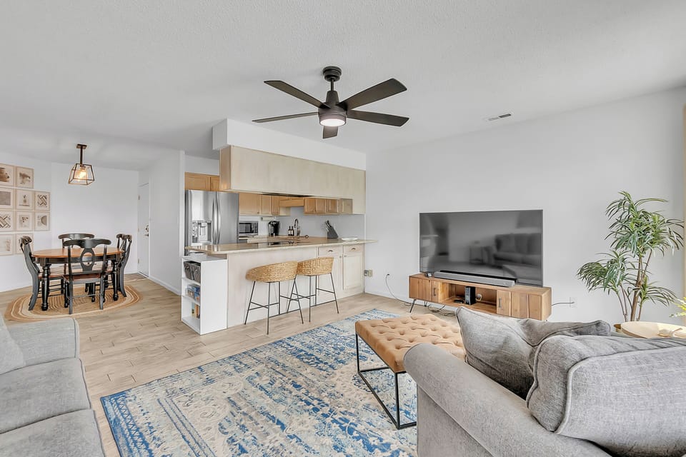 Relax in your beautifully designed open-concept space where modern comfort meets warm wood accents and natural light fills every corner.