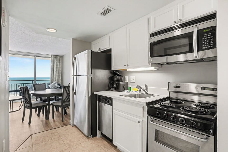 Luxury Condo, Balcony | Private kitchen | Full-size fridge, microwave, oven, stovetop