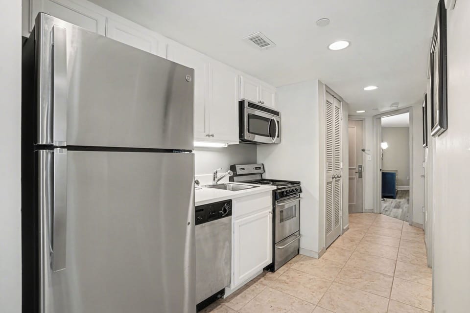 Luxury Condo, Balcony | Private kitchen | Full-size fridge, microwave, oven, stovetop