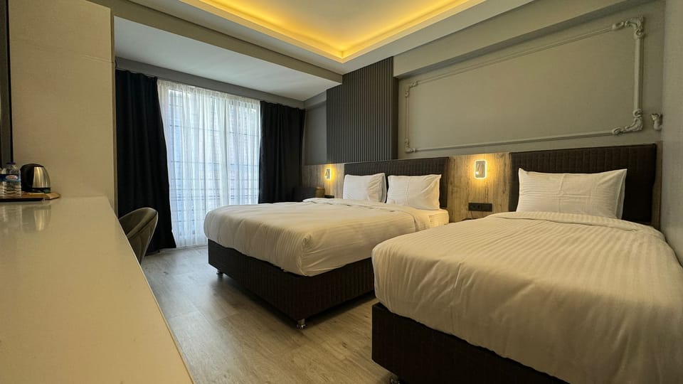 Triple Room | Premium bedding, minibar, in-room safe, laptop workspace