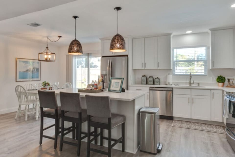 A large open floor plan kitchen has all the cooking essentials.
