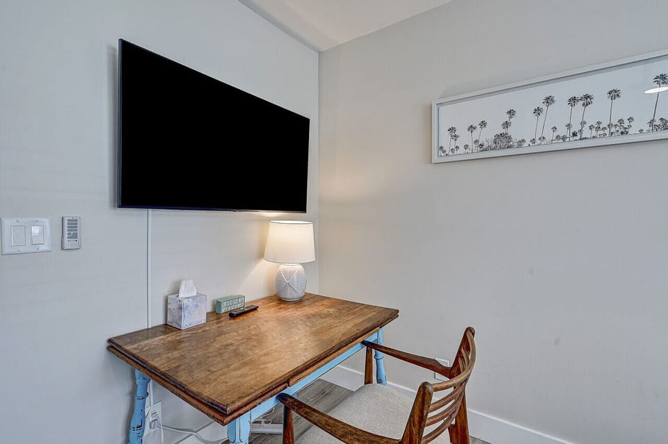 TV and workspace in bedroom four.