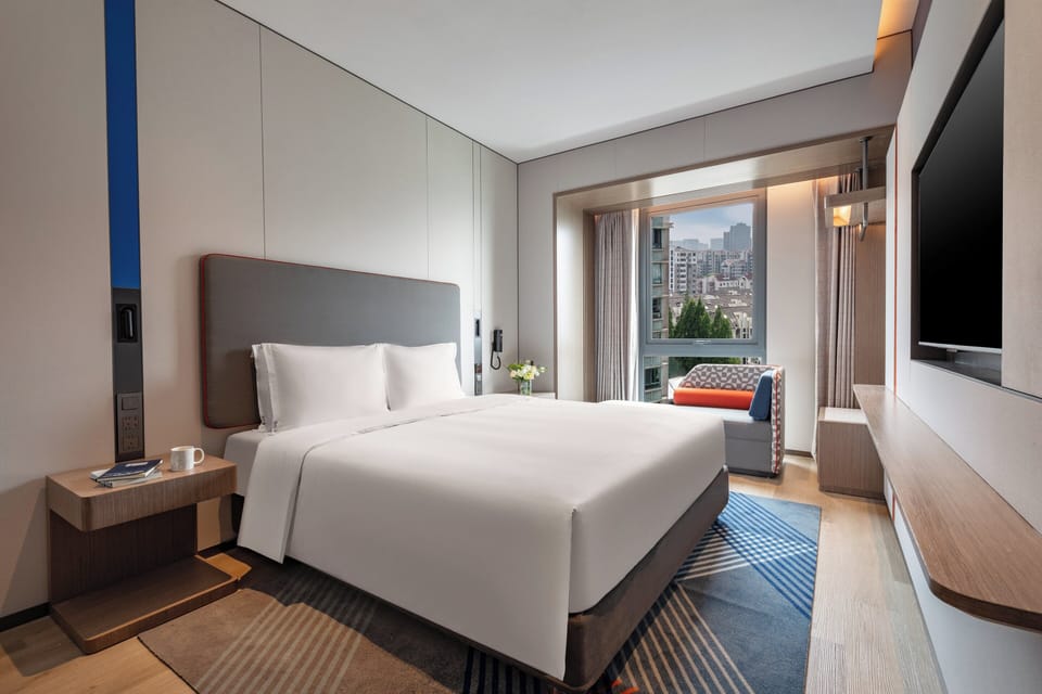 Premium bedding, down comforters, desk, laptop workspace