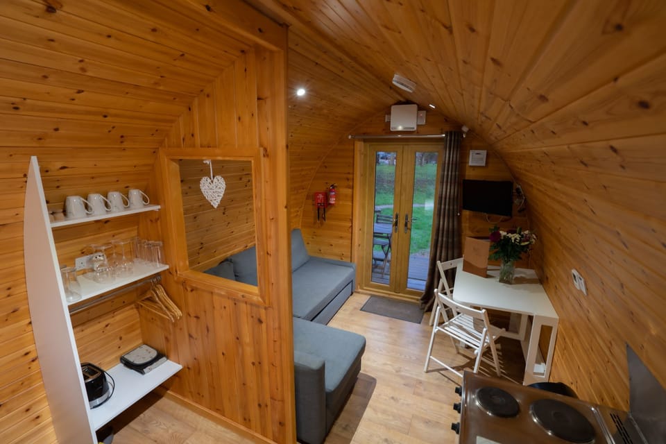 Lounge area with pull out sofa bed, flat screen tv and lake views