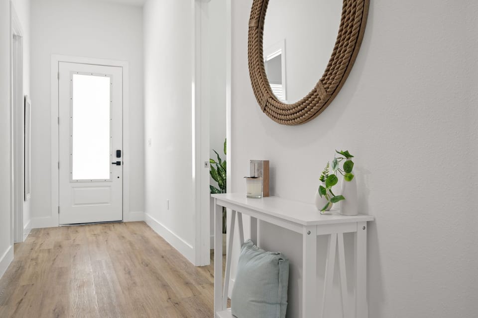 Welcoming entryway with stylish décor and plenty of natural light