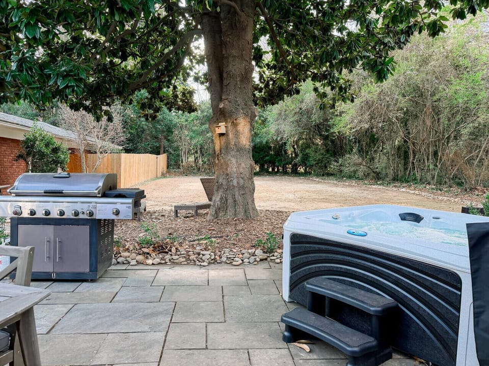 Hot tub, propane grill, and outdoor seating for 6