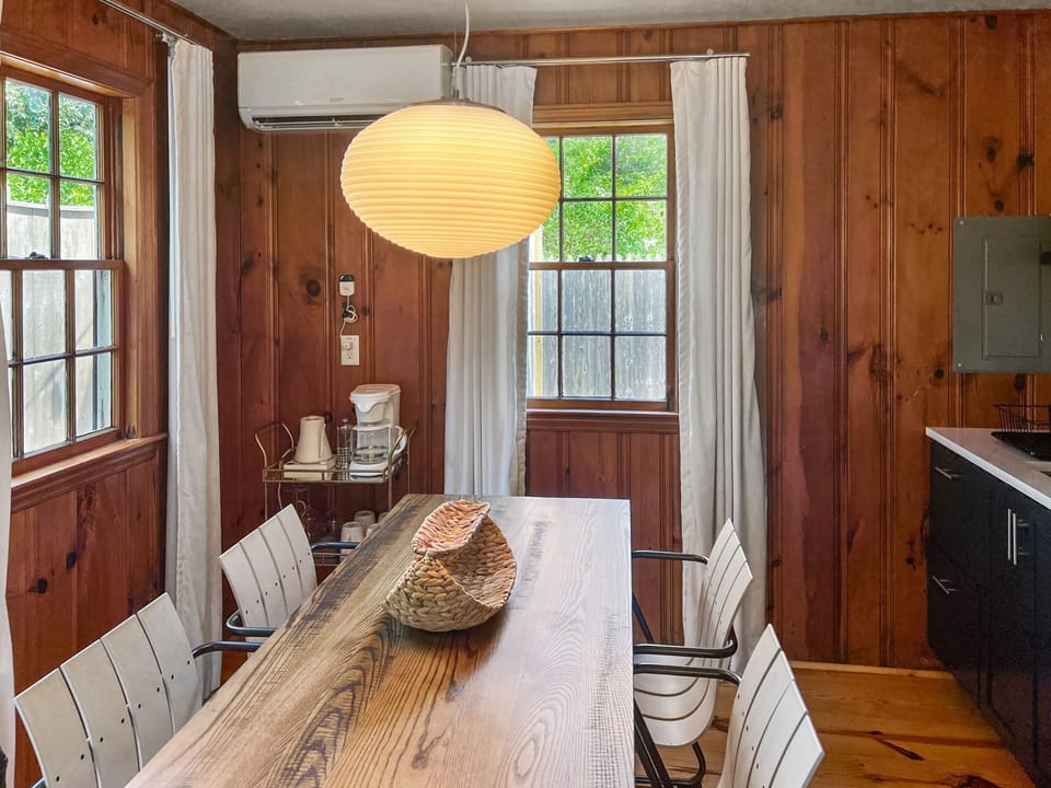 Large dining table with seating for four also presents opportunities for game nights or puzzle construction