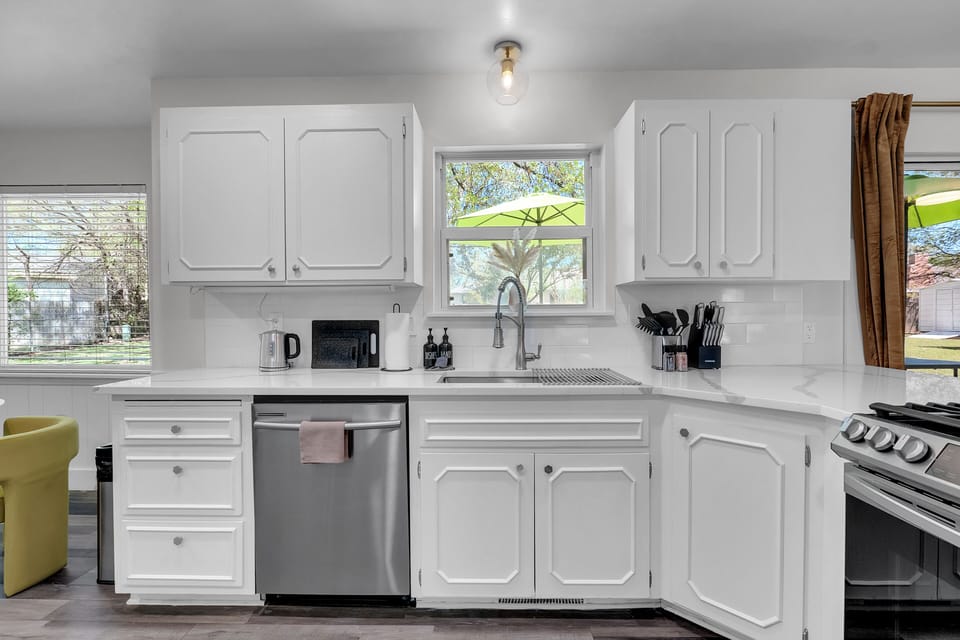 Prepare meals in the well-appointed kitchen boasting marble countertops.