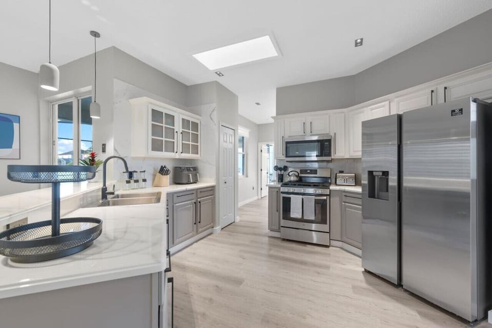 KITCHEN #Quiet #renovated #Stylish #Disney #Parks #kingdom #springs #poolhouse #Vacation #Rental #waterpark #Kissimmee #Orlando #universal #citywalk #legoland #shortstay #longstay #bbq #grill #privatepool