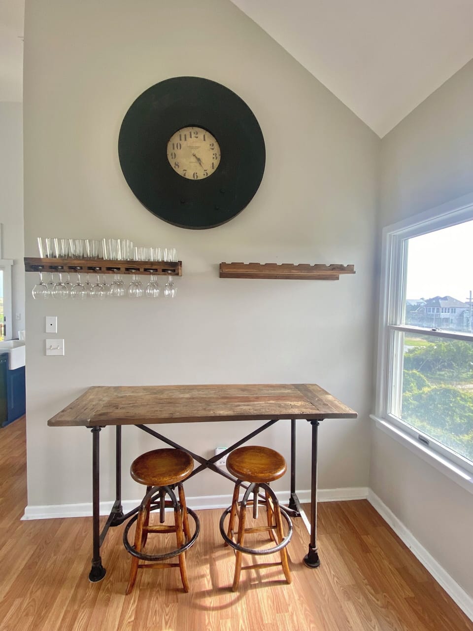 Bar area is open to living/dining/kitchen & adds to island seating to fit 18