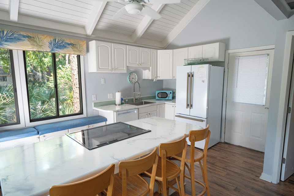 Plenty of cabinet space and kitchen deep sink for guest use!