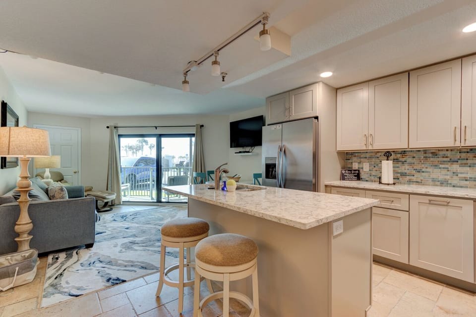 Kitchen flows nicely into the living area.