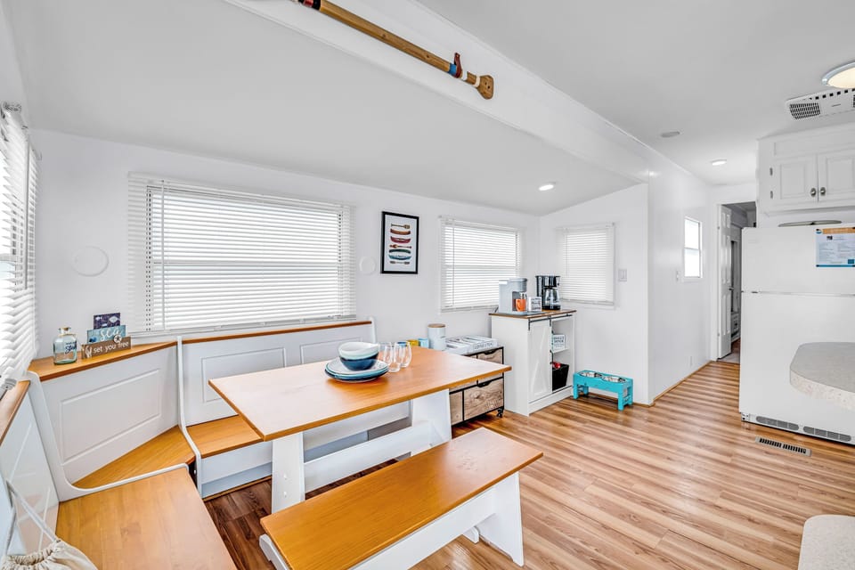 Gather for meals, games, or coffee in this bright dining nook with a full coffee station nearby.