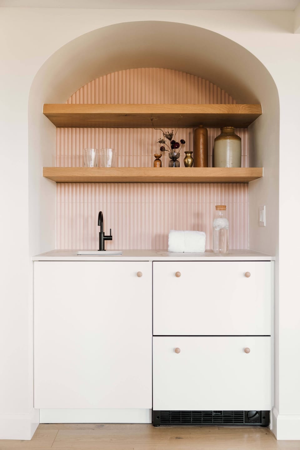 Wet bar off of living room for pre/post-pilates refreshments or cocktail crafting.