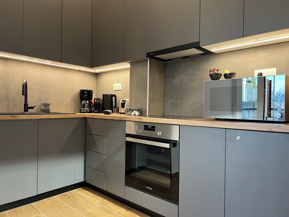Penthouse | Private kitchen | Full-size fridge, microwave, oven, espresso maker