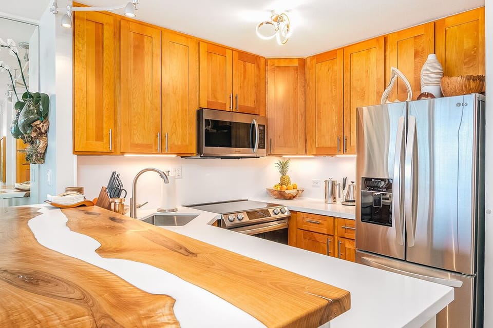 Cozy kitchen with custom walnut countertop and maple cabinets.