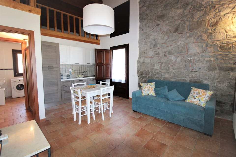 Deluxe Apartment, Sea View | Living area | Flat-screen TV