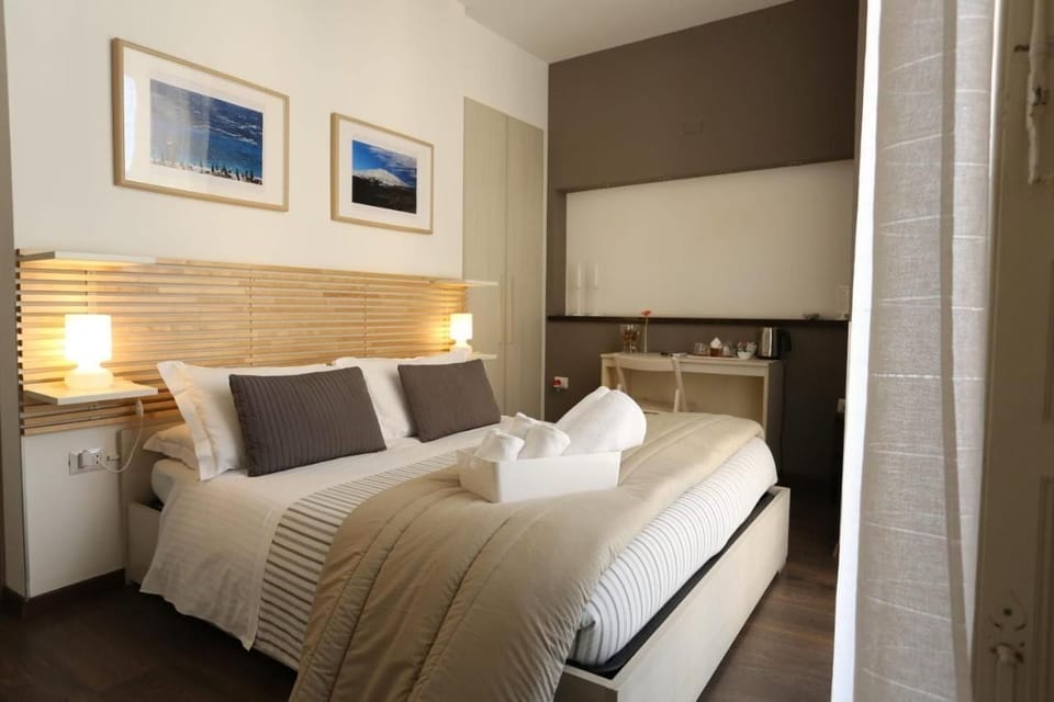 Classic Quadruple Room, City View | Down comforters, desk, laptop workspace, blackout drapes