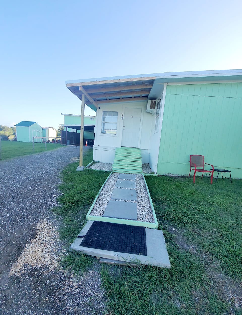 few steps  up to get into the studio/two chair   outside /smoke area