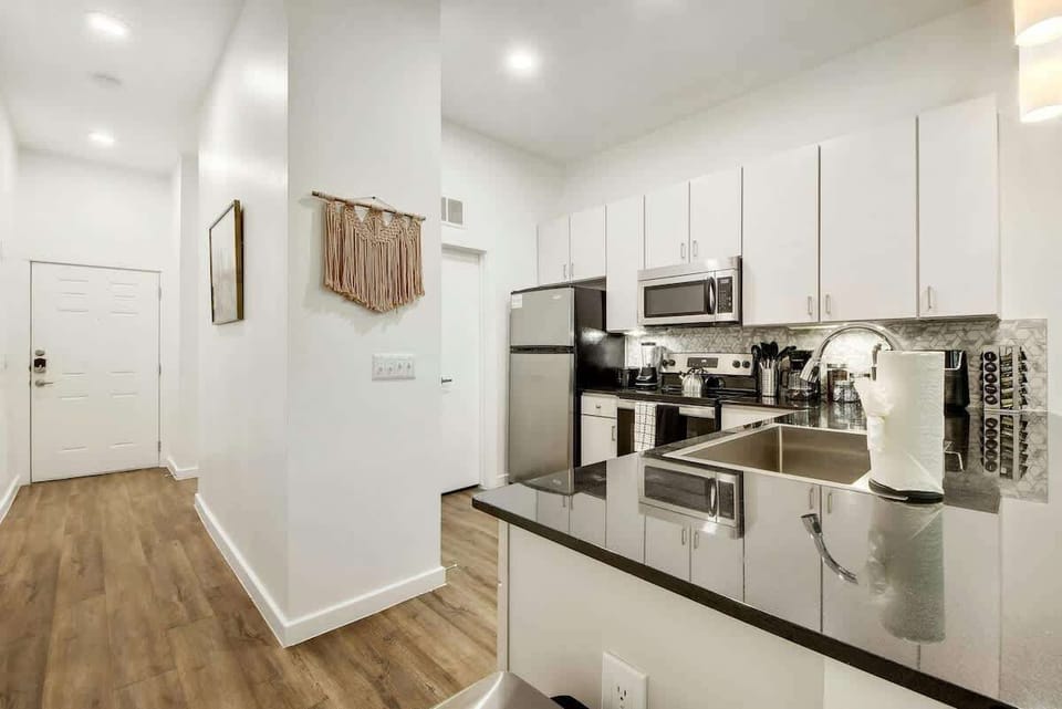 A large kitchen area opens up to the rest of the apartment for easy entertainment while cooking