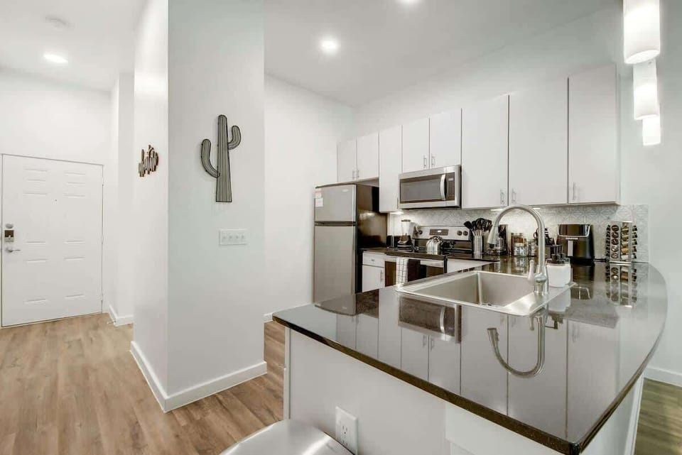 A large kitchen area opens up to the rest of the apartment for easy entertainment while cooking