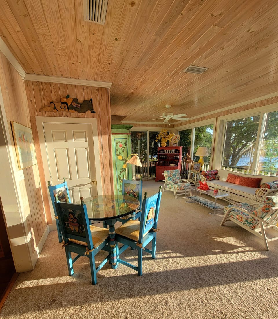Part of the front room downstairs, with a card/game table.
