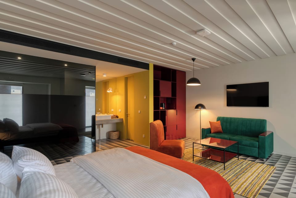Standard Double Room | Minibar, in-room safe, individually furnished, blackout drapes