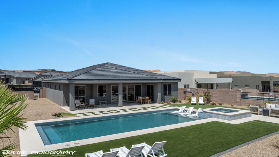 Backyard with pool, sun deck, wet deck, and furniture