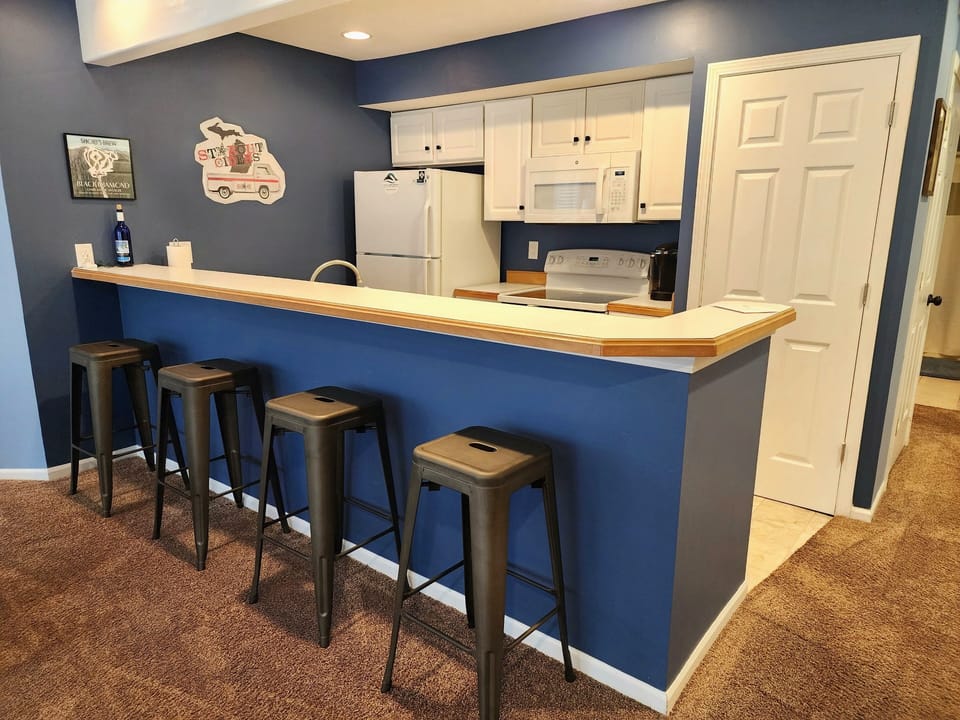 Kitchen bar with additional seating. 
