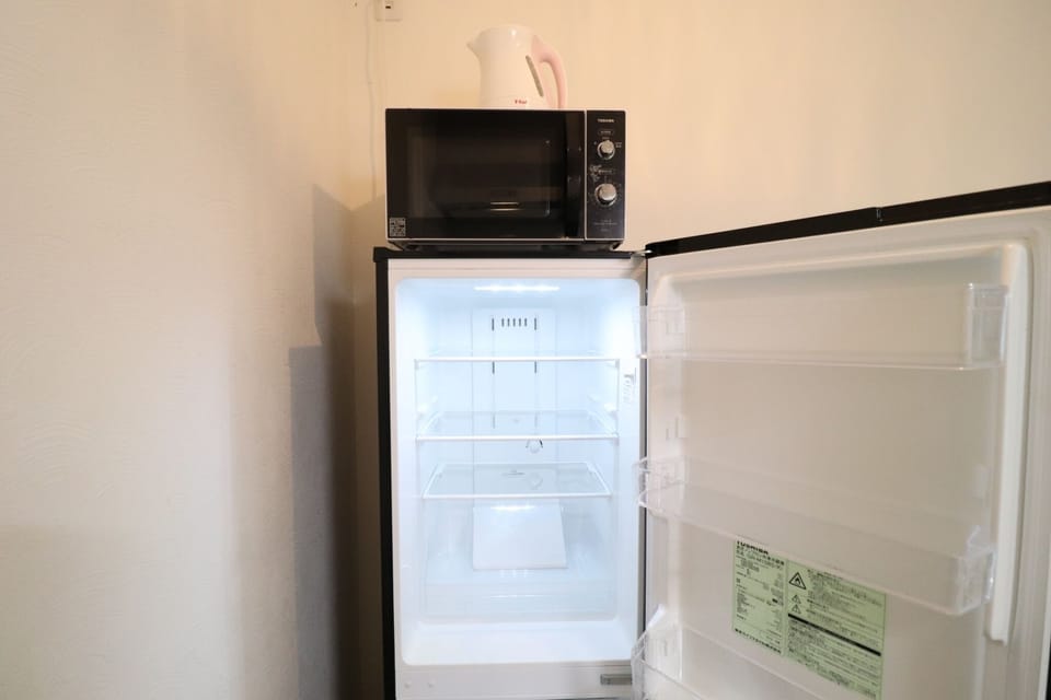 City Townhome, Non Smoking | Private kitchen | Full-size fridge, microwave, stovetop, electric kettle