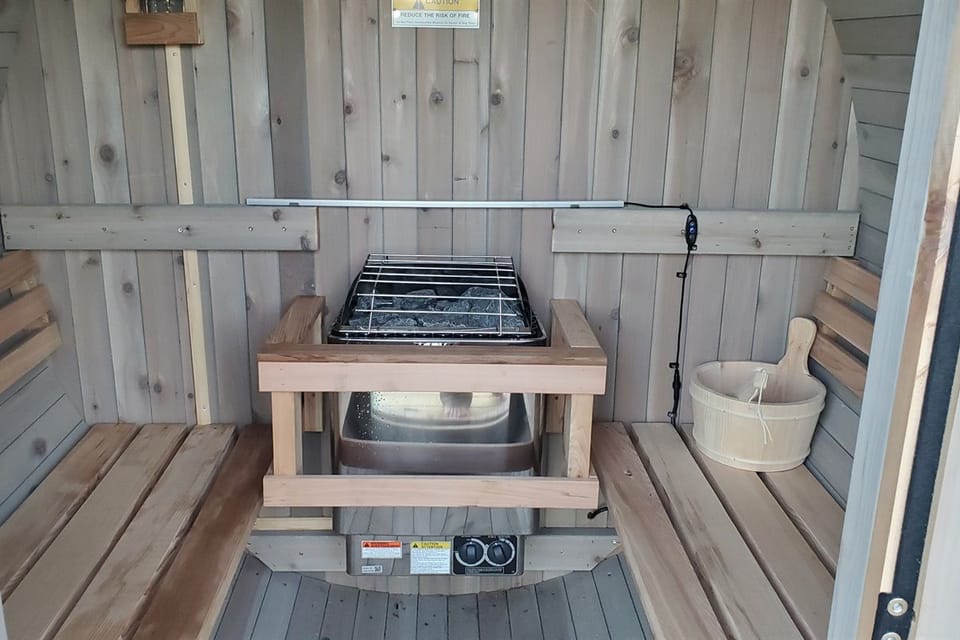 Pour a ladle of water over the heater rocks and settle onto the bench — the ache from a long cold-weather hike melts away before you even start to sweat.