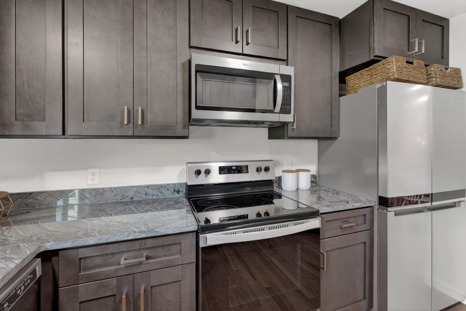 Updated kitchen with stainless steel appliances.