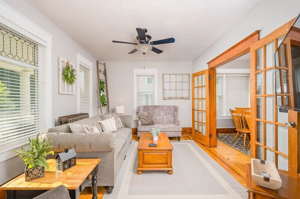 Spacious living room with plenty of seating and a 55" smart TV