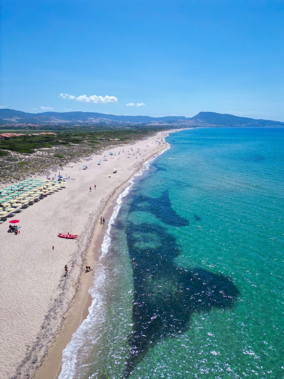 Private beach, white sand, sun loungers, beach umbrellas