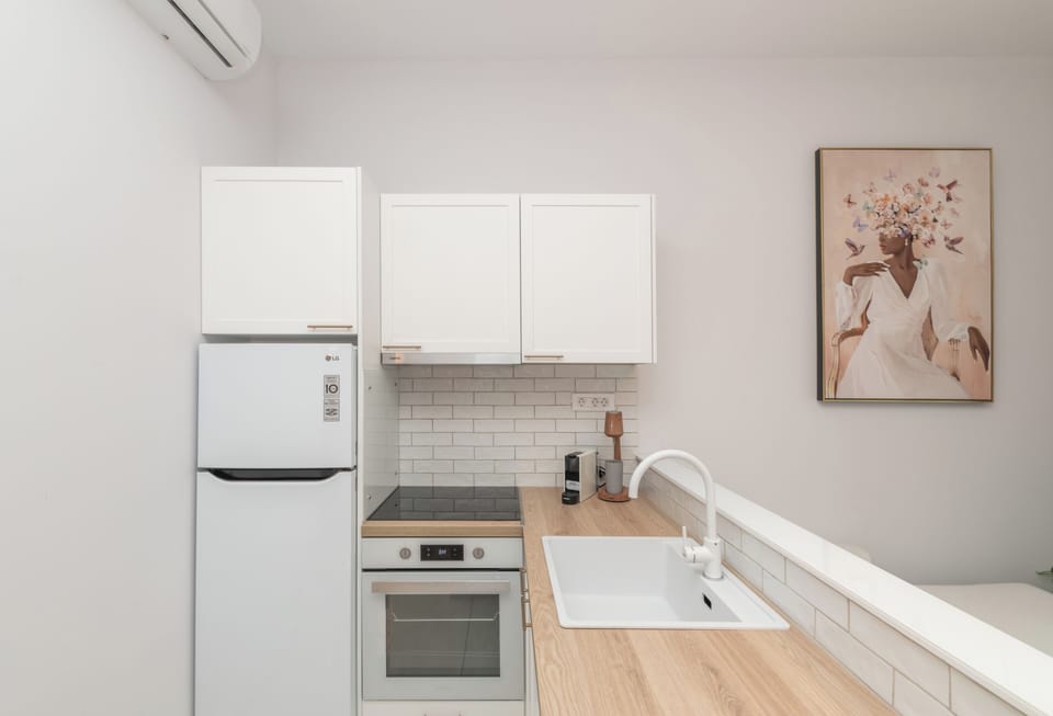 Luxury Suite, Pool View | Private kitchen | Full-size fridge, oven, stovetop, espresso maker