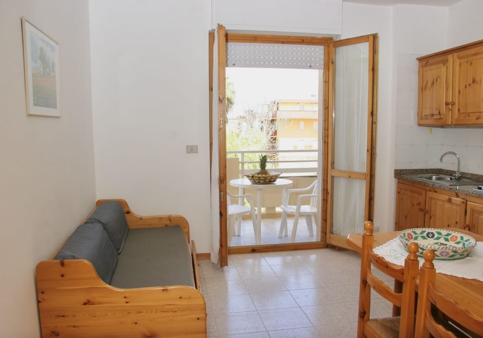 Apartment | Living area | 24-inch flat-screen TV with satellite channels