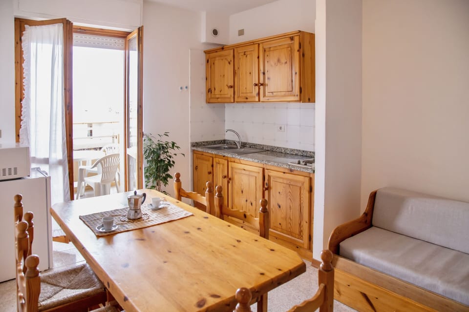 Apartment | Living area | 24-inch flat-screen TV with satellite channels
