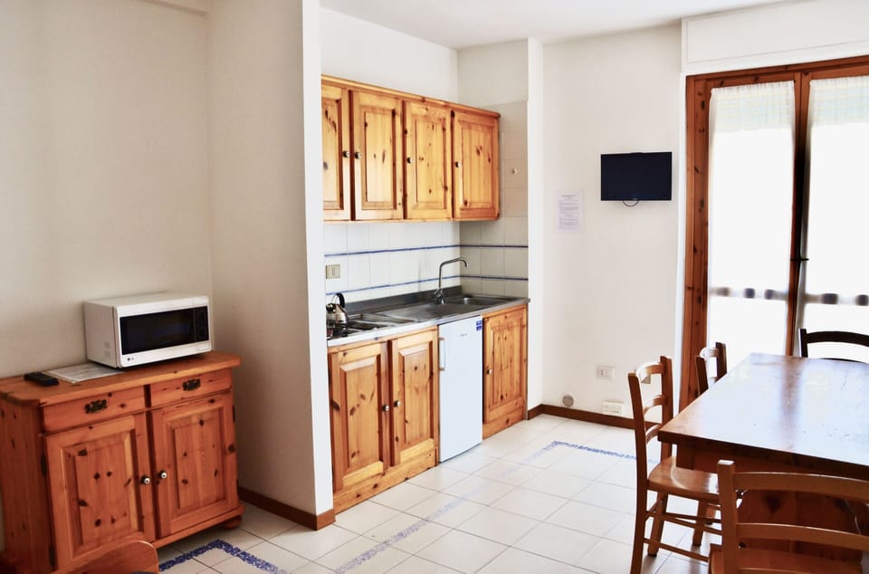 Apartment | Living area | 24-inch flat-screen TV with satellite channels